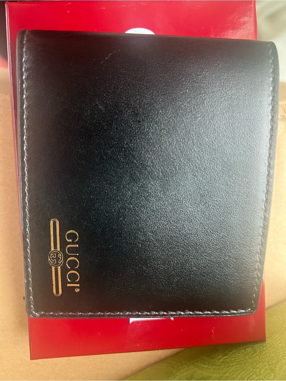 Gucci Black Leather Bifold Wallet with Gold Logo Accent